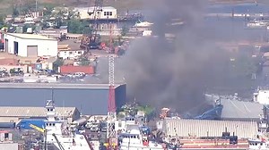 Large fire burns at junkyard in Staten Island