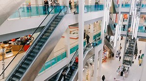 Time-lapse shopping center and escalator, hurrying people, 4k