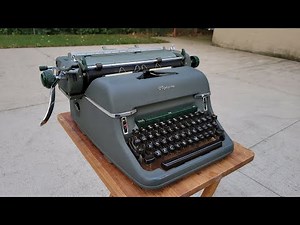 Typing outside on a 1960 Olympia SG-1 typewriter