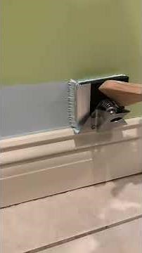 PERFECT PAINT EDGER cutting in along a baseboard