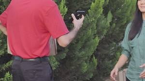 Woman at the door of her house receives a parcel by mail - Free Stock Video