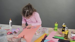 Kids papercraft. Making paper bugs out of the empty toilet paper rolls and construction paper.