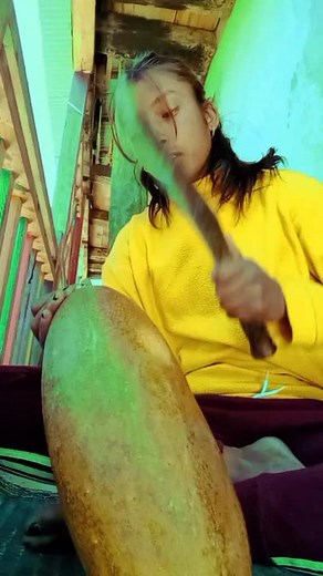 Exploring Traditional Instruments: Playing a Gourd