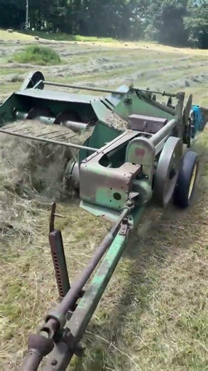 John Deere 14T Baler In The Hay Field