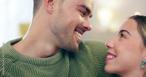 Couple, eskimo kiss and hug with trust and love, man and woman talking and bonding, romance at home. Happy relationship, people relax in lounge with nose touch and communication, commitment and care