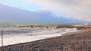 Sea wawes washed pebbles and mooring