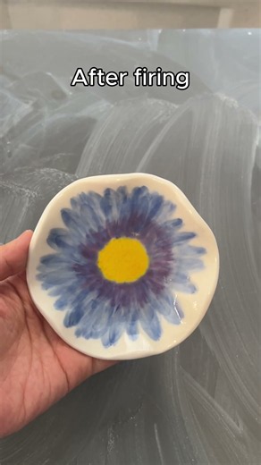Gerbera plate transformation: bisque to glaze to gold luster! ✨ The gold adds total flair. #ceramics