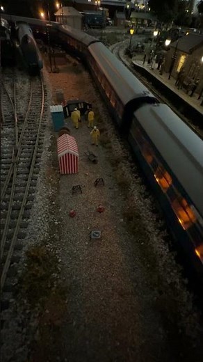 Class 47 pulling The Coronation Scot past the roadworks at dusk.