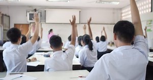 clip-1064396869-slow-motion-asian-high-school-students-white