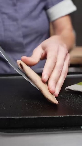 Chef Maylin Chavez plates Blue Evolution Wakame Tételas with Guajillo Salsa, Quesillo, Serrano on Heart and Soul 10.5” Flat High Rim Plate in Thyme from Libbey Pro #sponsored by Libbey Pro #chefsroll #rollwithus #libbeyfoodservice #libbeypro #servingexperience #crfeatureslibbey | Chef's Roll