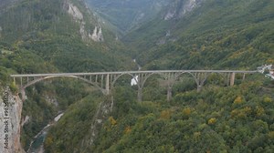 Aerial view of bridge on Tara river canyon in Montenegro. The roadway stands 172 meters (564 ft) above the Tara River.