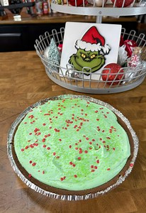 This is the perfect holiday treat! Grinch Pie! CJ shows you how to make this awesome pie. Gives all of those holiday feels with the Grinch Pie! This Grinch isn't a mean one! What you'll need: -Jello instant puddin - pistacio flavor. -Cool whip defrosted. -Chocolate pie crust. -2 cups milk. -Green food coloring. -Red and green sprinkles. How to make it: Mix the pudding according to the box directions. Pour the pudding into the pie crust. Put some red sprinkles in the mix. Place in the refridgerat