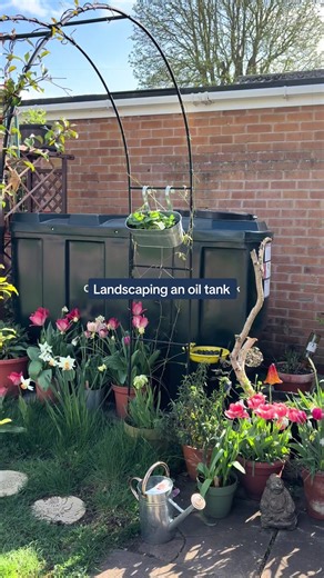 The never ending project of disguising my oil tank without obstruction health and safety guidelines #oiltank #garden #diy #gardening #rental