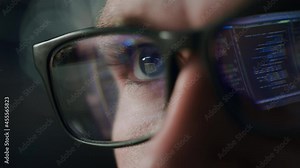 Close-up Portrait of Software Engineer Working on Computer, Line of Code Reflecting in Glasses. Developer Working on Innovative e-Commerce Application using Machine Learning, AI Algorithm, Big Data