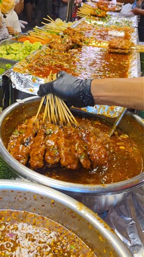 So deliciously dipped in sauce‼️ Grilled pork skewers with spicy waterfall sauce, 10 baht each, f...