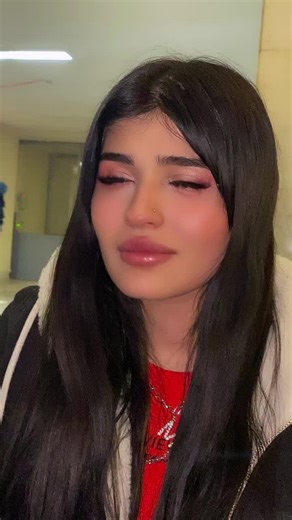 Stylish Indoor Look with Long Black Hair and Red Shirt