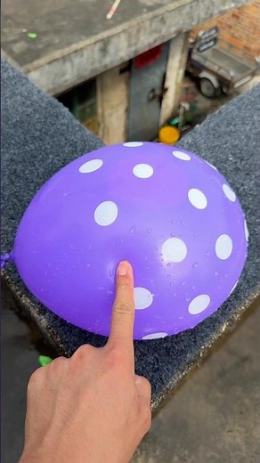 Experiment: Will a water balloon explode if it rolls down a tall building? 💥🎈 #balloon