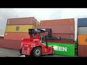 Kalmar Reach stacker with a tilting spreader for container handling