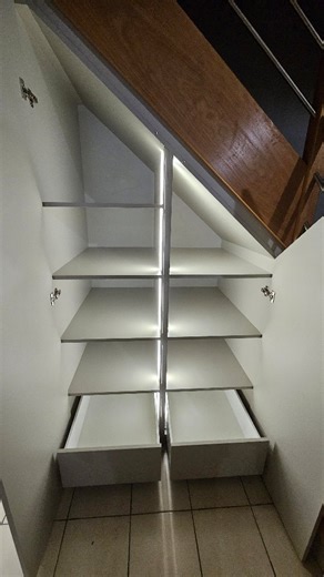 STN Création bois on Instagram: "Aménagement sous escalier en melaminé gris. Ces espaces difficiles à agencer sont toujours intéressants à optimiser. Dans ce coin peu lumineux on a fait le choix de positionner des LEDs qui s’allumeront à l’ouverture des portes. 💡Une envie, une idée, un rêve… Prenez contact avec nous pour construire ensemble votre mobilier de demain. 💻 www.stncreationbois.fr 👏🤘 #artisanatfrancais #artisan #surmesure #entrepreneur #rennesmetropole"