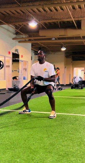 “Battle rope squatting: Take your leg workout to the next level! Incorporate battle ropes to engage your upper body and boost cardiovascular endurance. Start by grabbing the battle ropes with an overhand grip, stand with feet shoulder-width apart, and descend into a squat position while simultaneously performing waves with the ropes. This exercise targets your quads, glutes, core, and arms. Strengthen muscles, burn calories, and have a blast! 🌊🏋️‍♂️💥 #BattleRopeSquatting #NextLevelLegWorkout