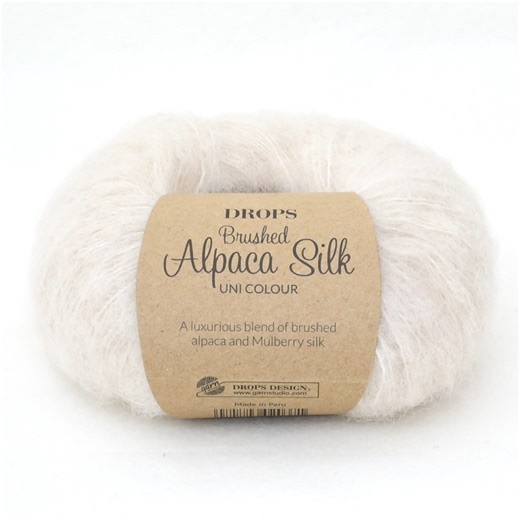Indulge in the luxury of DROPS Brushed Alpaca Silk, an exquisite blend of brushed superfine alpaca and shimmering silk. Soft, elegant and available in a stunning palette of colours, from delicate beige and gray to vibrant reds and purples. And the best part? You can get it with a 30% discount for the rest of the month! https://www.garnstudio.com/yarn.php?show=drops-brushed-alpaca-silk&cid=19 #dropsdesign #dropsbrushedalpacasilk #dropsyarn #dropsgarn #garnstudio | Garnstudio DROPS design
