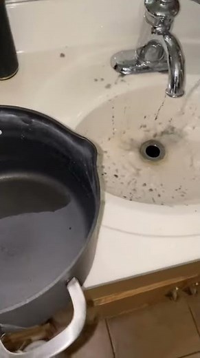 Person Trying to Unclog Drain Accidentally Causes Explosion of Black Liquid From Sink - 1182044