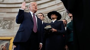 Trump doesn't place hand on Bible during swearing-in