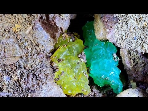 Colorful crystals in a volcanic cave. Perfect digging process for diamonds, agates, emeralds