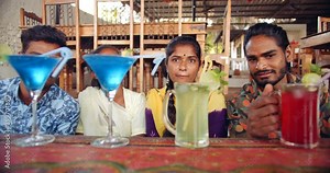 Two women and two men looking staring leeching at cocktail tasy delicious mocktail drinks liquid alchol times to party enjoy have fun joyous smile while wearing masks