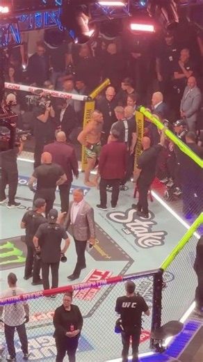 Bruce Buffer, Mike Beltran, Max Holloway and his family consoled Conor McGregor after his injury at