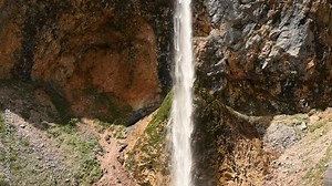 Rinka Falls in the Logar Valley (Logarska dolina) in the Kamnik Savinja Alps in Slovenia during a beautiful springtime day. Slow motion clip.