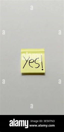 Yellow sticky note with handwritten YES text in black ink isolated on white background representing approval agreement or positive decision concept Stock Video Footage - Alamy