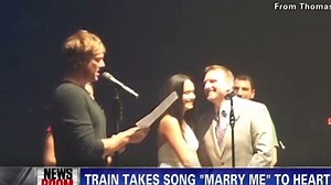 Train marries couples onstage