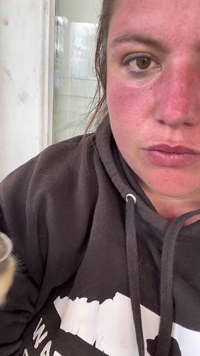 Holding a Small Bird: A Captivating Close-Up