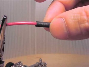 Applying heat shrink tubing