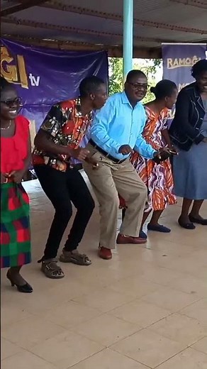 Mawego girls teachers led by Able principal Rebecca on stage presenting a Luo dance to Ramogi tv..