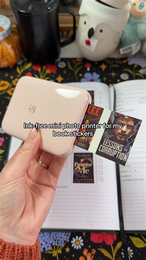 Jackie’s Book Tally 📚 on Instagram: "I’ve tried three different mini photo printers for my reading journal and this is the only one that actually prints my book covers in real, vivid color. The others always came out washed out or muddy, but this one gives me crisp, vivid minis that look exactly like the covers, and it’s also the most affordable one I’ve found. I use it constantly for my review pages, TBR spreads, and little bookish stickers and #BookishStickers #ReadingJournal #MiniPhotoPrinte