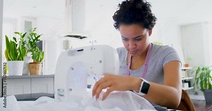Woman stitching clothes on sewing machine