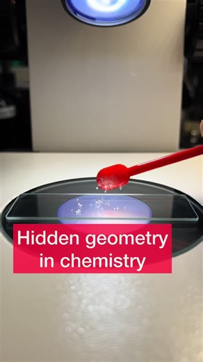 The salt I used in this video is monoammonium phosphate. As you can see at the start of the video, when monoammonium phosphate comes into contact with water, its crystal structure breaks apart almost instantly, dissolving into ammonium and dihydrogen phosphate ions that become surrounded by water molecules. . As the water begins to evaporate on the glass slide, the ions become more concentrated and start to reorganize. Nucleation points form where the first tiny crystals appear, and from those p