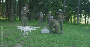 Army engineer using drone to monitor enemy and complete military action