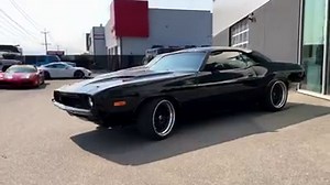 August Motorcars is honoured to be offering this incredibly well done 1973 Dodge Challenger Restomod, presented in Jet Black Metallic with Black Leather Recaro Seats and perfectly complimented by Carbon Fiber Interior Trim. Expertly detailed by our professional detail bay upon arrival, this amazing restored and modified classic has been extremely well cared for, comes to us in great condition,built by Farley’s in Calgary, and passes our stringent 100 point inspection making it August Certified. 