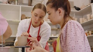 Guided pottery class in a cozy studio for beginners learning techniques Stock Video