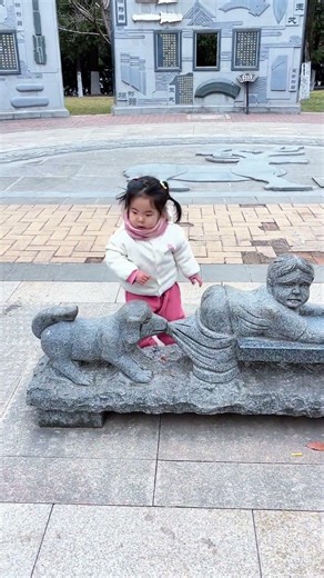 Cute Chinese Child Playing Joyfully – Adorable Playtime Moments