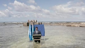 Tuvalu minister stands in sea to film COP26 speech to show climate change