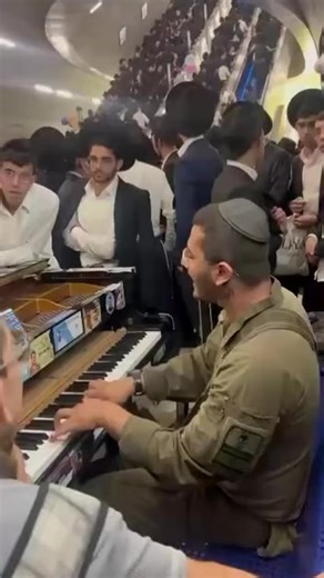 1.2K views · 68 reactions | Jerusalem railway station this morning. Yeshiva students on their way to a demonstration against their recruitment in the army listening to a soldier playing the piano. This is Israel | Aryel Tsion Israel Guide & Int. Speaker | Facebook