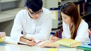 clip-31169587-young-students-study-hard-library-asian-female