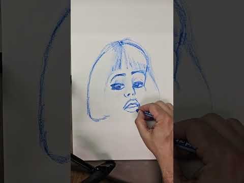 Drawing a profile using blue chalk pastel.