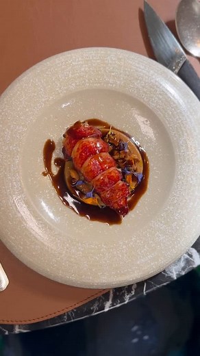 Maison Rostang on Instagram: "Le homard bleu s’enflamme🦞 Cuit au barbecue, confit dans un beurre de verveine, girolles et cerises acidulées Un plat qui raconte ma vision d’un été élégant qui se grave dans l’air du temps chez @maison_rostang ✨ 📹 @culinary_agency #michelin #paris #maisonrostang #guidemichelin #foodlover #gastronomie #restaurant #summer"