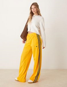 adidas Originals Firebird Loose track pants in yellow  | ASOS