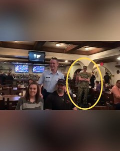 The sailor hiding in the background of this picture is about to send his family into a frenzy. 📸 wtsp.com | 10 Tampa Bay